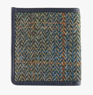 This is the rear view of the Harris Tweed card and note holder in blue and green, it is a blue and green small herringbone design with a blue, tan and orange overcheck.  It is trimmed in brown leather.