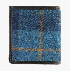 This is the rear view of the Harris Tweed card and note holder in blue check, it is a dark blue and mid-blue check with a red and yellow over check, it is complemented in black leather. 