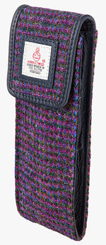 This is the side view of the Harris Tweed glasses case in violet, it is a purple, black, pink and blue subtle check design and is trimmed in black leather. You can see the side of the glasses case which is also black leather.