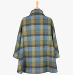 This is the rear view of the cape in denim sage, the colour is blue, brown and green check. You can see the collar folded down and the cape draping beautifully at the back.