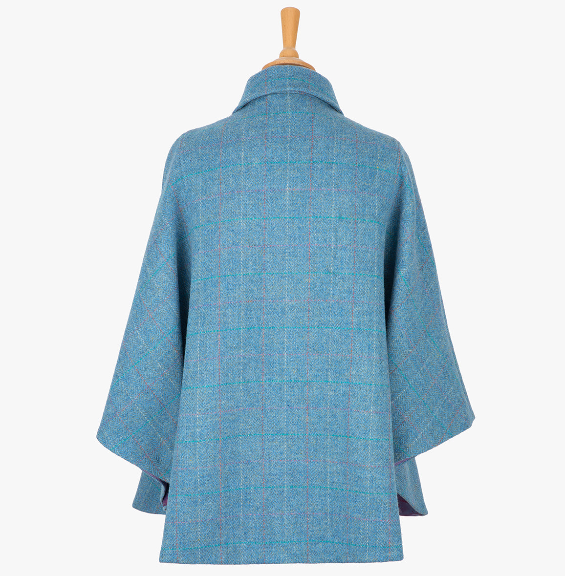 This is the rear view of the cape in sky blue, the colour is sky blue with a white, red and subtle turquoise overcheck. You can see the collar folded down and the cape draping beautifully at the back.