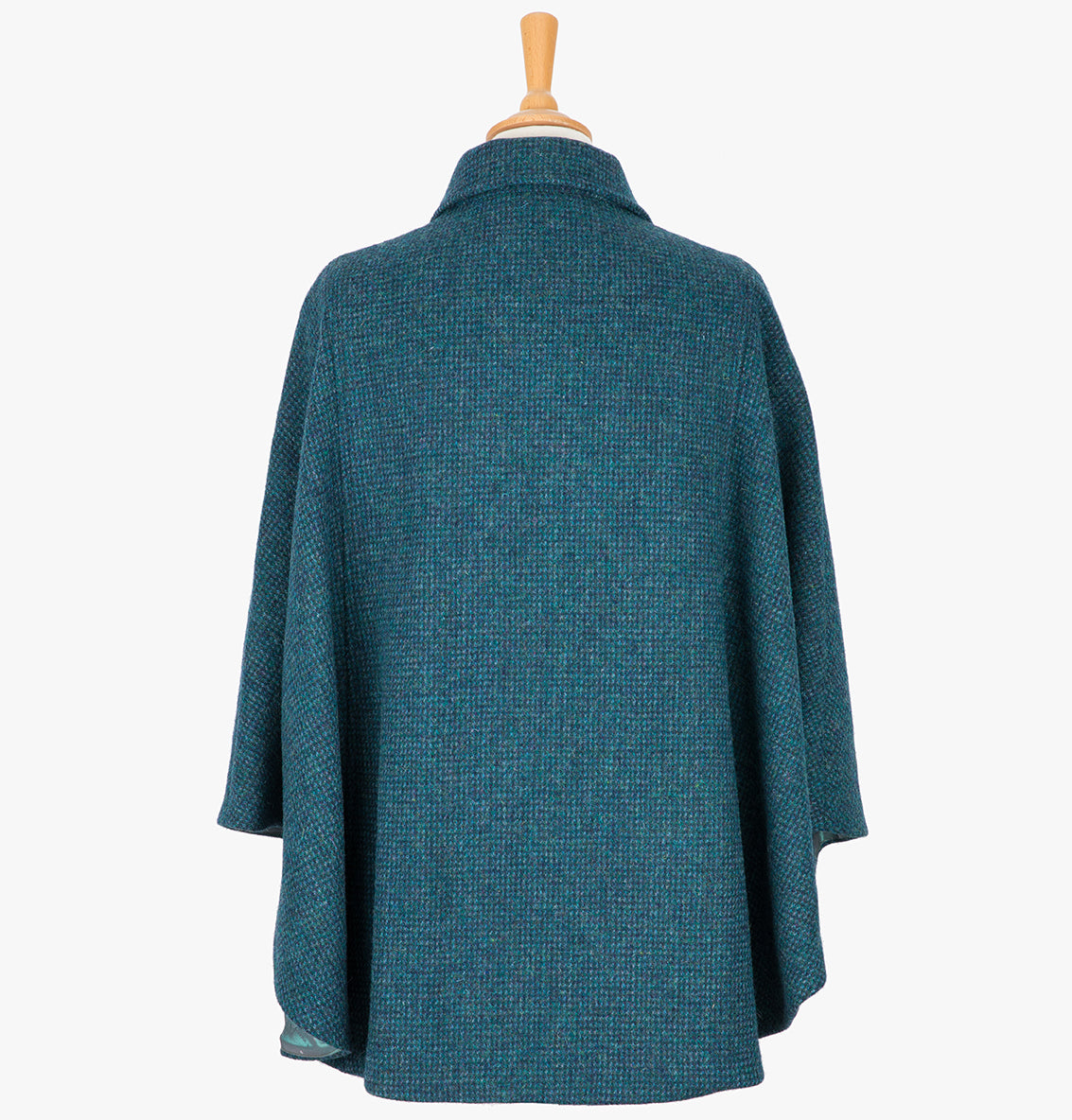 This is the rear view of the cape in Teal, the colour is  teal and navy subtle houndstooth check. You can see the collar folded down and the cape draping beautifully at the back.