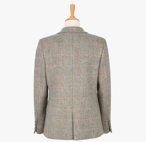 Rear view of our Harris Tweed ladies jacket in pastel check, the colour is a cream and brown small herringbone with a pink and blue overcheck. It has a neat back with a smal single vent.