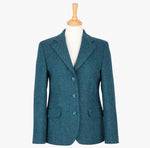 Harris Tweed ladies jacket in Teal, the colour is ateal and navy subtle houndstooth check. It has three buttons and two pockets.