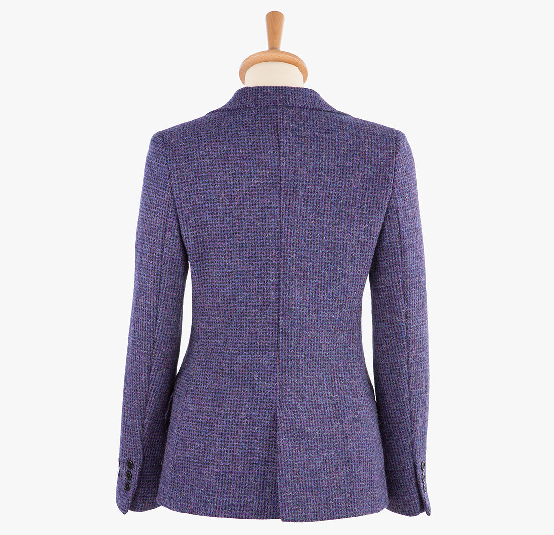 Rear view of Harris Tweed ladies jacket in violet the colour is a purple. It has three buttons on the sleeve and a back vent.