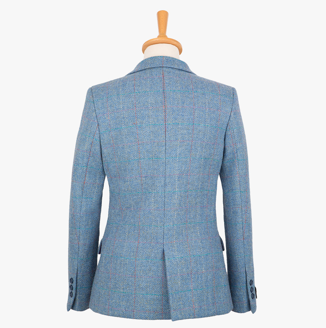 Rear view of our Harris Tweed ladies jacket insky blue, the colour is sky blue with a white, red and subtle turquoise overcheck.. It has a neat back with a smal single vent.