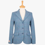Harris Tweed ladies jacket in Sky blue, the colour is sky blue with a white, red and subtle turquoise overcheck. It has three buttons and two pockets.