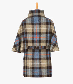 This is the rear view of the belted cape in Camel check, the colour is brown and taupe check, with an orange and white overcheck. You can see the collar stood up and the neat belt at the back.