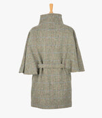 This is the rear view of the belted cape in pastel check, the colour is cream and brown herringbone with a pink and blue overcheck. You can see the collar stood up and the neat belt at the back.