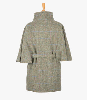 This is the rear view of the belted cape in pastel check, the colour is cream and brown herringbone with a pink and blue overcheck. You can see the collar stood up and the neat belt at the back.