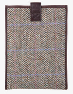 Reverse view of Harris Tweed tablet case in pastel check trimmed with leather.