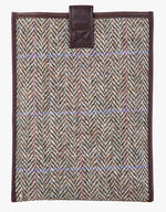 Reverse view of Harris Tweed tablet case in pastel check trimmed with leather.