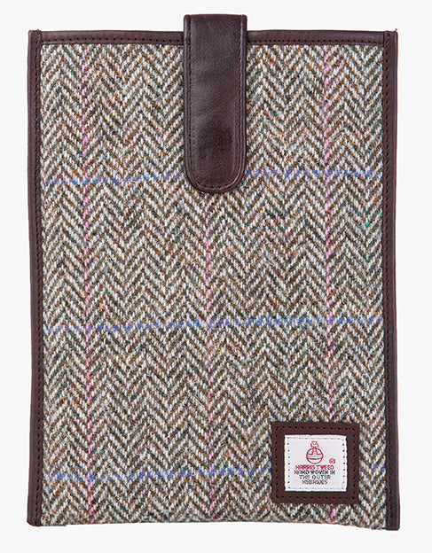 Harris Tweed tablet case in pastel check trimmed with leather. This case has a magnetic closing and a small Harris Tweed logo at the bottom of the case.