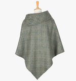 Rear view of the grey check poncho which drops over the head and drapes gently over the shoulders. It comes mid-way down the arms and finishes at a point at the back. The colour is grey check with a black, yellow, pink and blue overcheck. It has a folded collar with 3 button holes on the left.