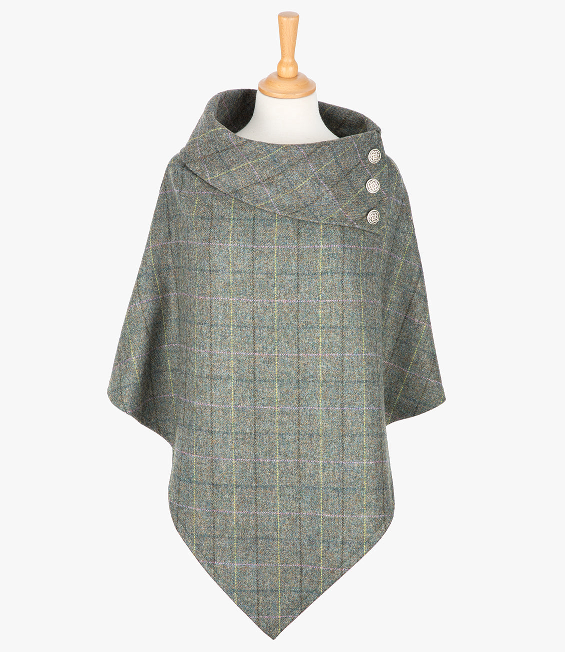 Tweed poncho in grey check. It drops over the head and drapes gently over the shoulders. The colour is grey check with a black, yellow, pink and blue overcheck. It comes mid-way down the arms and finishes at a point at the front. It has a folded collar 3 Celtic buttons in silver on the right hand side.