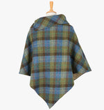 Rear view of the denim sage poncho, this drops over the head and drapes gently over the shoulders. It comes mid-way down the arms and finishes at a point at the back. The colour is a blue, brown and green check. It has a folded collar with 3 button holes on the left.