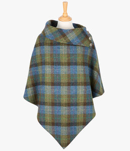 Harris Tweed poncho in Denim Sage check, it has a folded over cowl collar with 3 Celtic buttons detail.