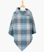 Harris Tweed poncho in Lavender check, it has a folded over cowl collar with 3 Celtic buttons detail.