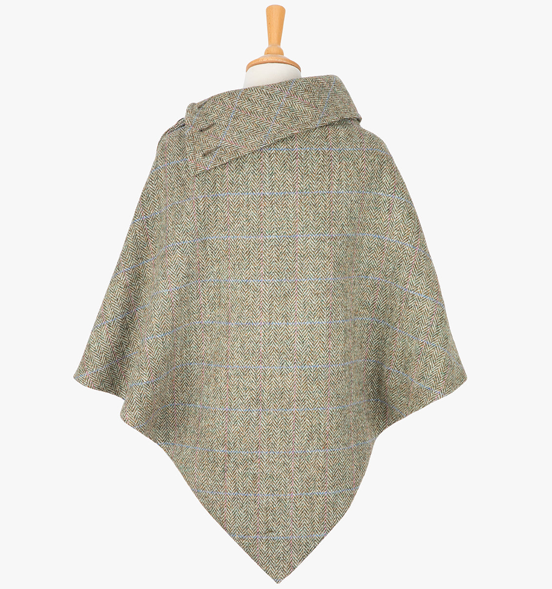 Rear view of the Pastel check poncho, this drops over the head and drapes gently over the shoulders. It comes mid-way down the arms and finishes at a point at the back. The colour is a neutral brown with a blue and pink overrcheck. It has a folded collar with 3 button holes on the left.