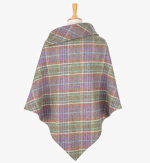 Rear view of the multicoloured poncho, this drops over the head and drapes gently over the shoulders. It comes mid-way down the arms and finishes at a point at the back.. It has a folded collar with 3 button holes on the left.