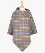 Harris Tweed poncho in Multi coloured check, it has a folded over cowl collar with 3 Celtic buttons detail.