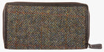 Rear view of Harris Tweed purse in brown herringbone with a brown leather trim.