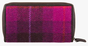 Rear view of Harris Tweed purse in Cerise with a brown leather trim.