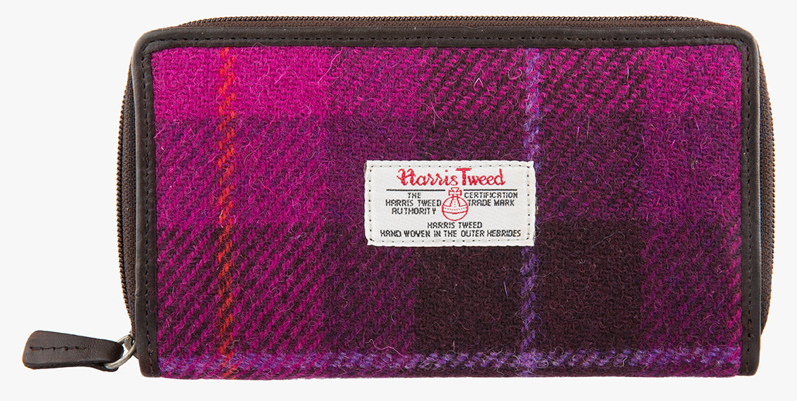Harris Tweed purse in Cerise with a brown leather trim.  It also has a Harris tweed logo on the front.