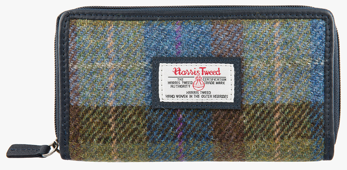 Harris Tweed purse in denim sage check with a navy leather trim.  It also has a Harris tweed logo on the front.