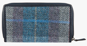 Rear view of Harris Tweed purse in Lavender check with a navy leather trim.  