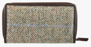 Rear view of Harris Tweed purse in pastel herringbone with a brown leather trim.