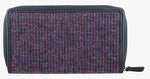 Rear view of Harris Tweed purse in purple with a navy leather trim. 