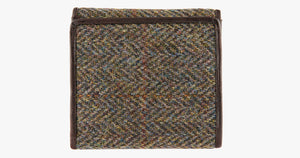 Rear view of Harris Tweed purse in Brown herringbone with a brown leather trim. 