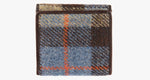 Rear view of Harris Tweed purse in camel check with a brown leather trim. 