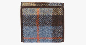 Rear view of Harris Tweed purse in camel check with a brown leather trim. 