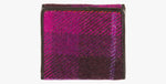 Harris Tweed purse in cerise with a brown leather trim.  It also has a Harris tweed logo on the front.