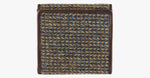 Harris Tweed purse in Heath nwith a brown leather trim.  It also has a Harris tweed logo on the front.