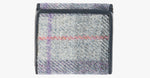 Rear view of Harris Tweed purse in lavender with a navy leather trim. 
