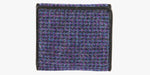 Rear view of Harris Tweed purse in Violet with a black leather trim. 