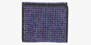 Rear view of Harris Tweed purse in Violet with a black leather trim. 