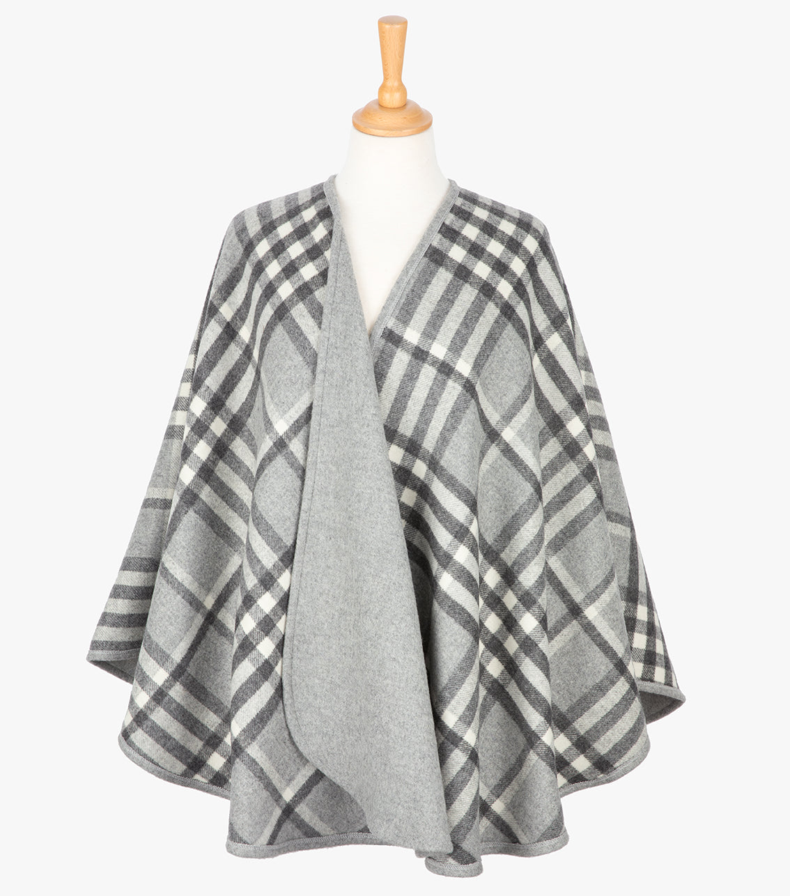 Reversible Wool and Cashmere serape/wrap in grey check it is grey on one side and a grey check on the reverse as shown.
