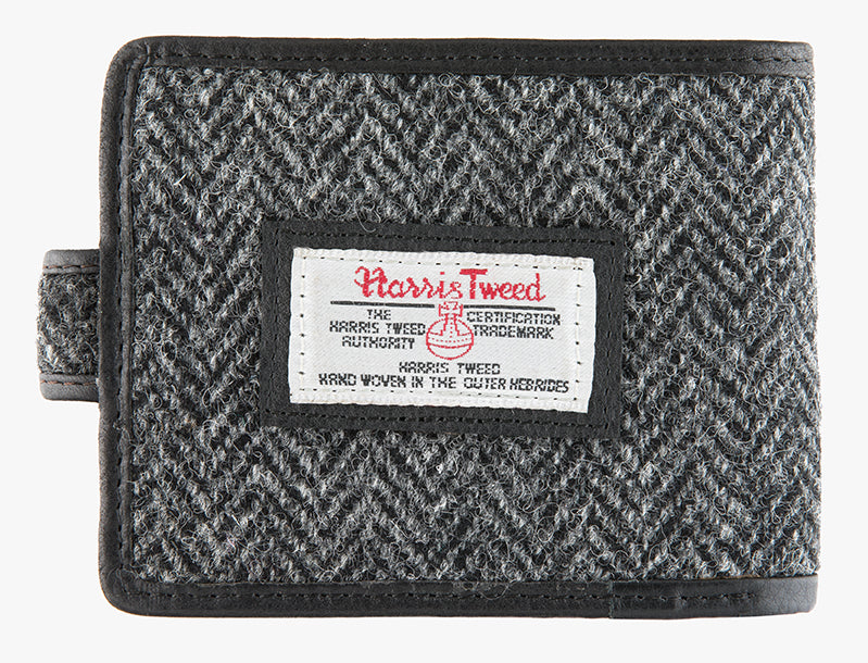 Reverse of Harris Tweed wallet in charcoal herringbone with the Harris Tweed logo in the middle.