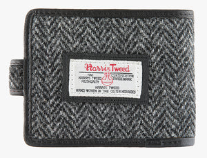 Reverse of Harris Tweed wallet in charcoal herringbone with the Harris Tweed logo in the middle.