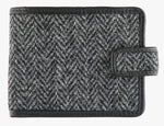 Harris Tweed wallet trimmed in leather in charcoal herringbone.